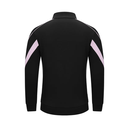 Black long-sleeve athletic jacket shown from the back, featuring light pink diagonal stripe accents on both upper arms and white piping along the shoulders, set against a plain white background.